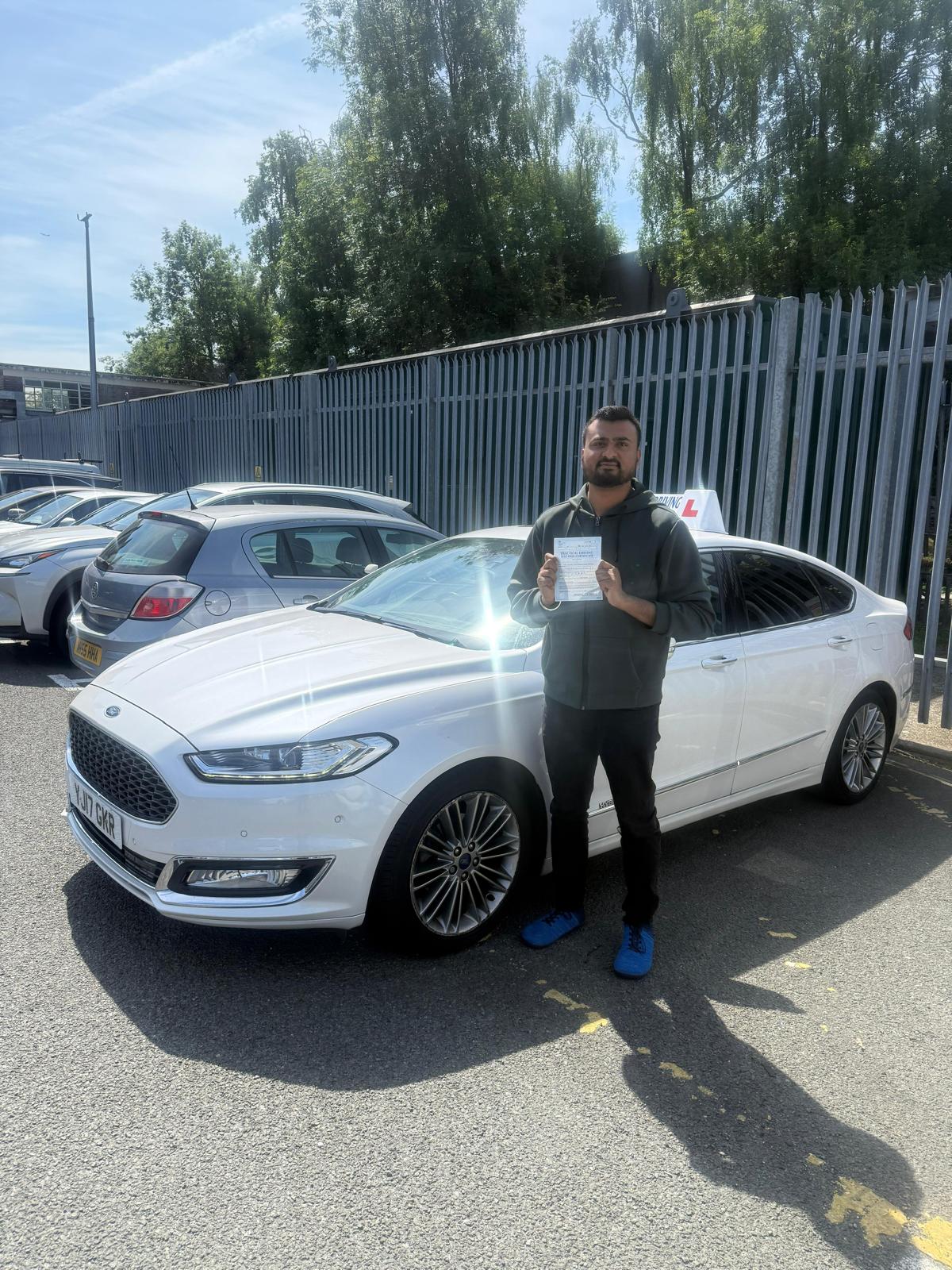 Student 16 celebrating passing their driving test with Top Gear Driving School